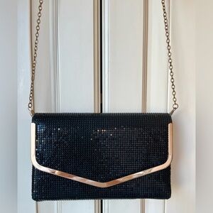 Aldo shoulder/handbag and clutch. Gold accents. Unique material.